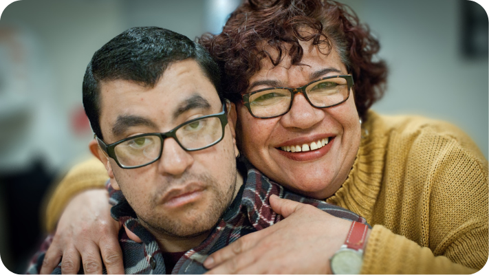 young man with IDD and his caregiver
